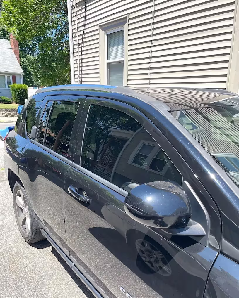 Dark Jeep with tinted side windows by Clean Tint